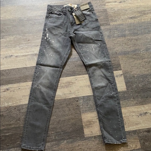 grey jeans with paint splatter